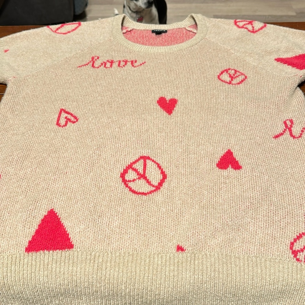 Torrid sweater darling.  Great for V-Day. Size 2. Peace signs and hearts.